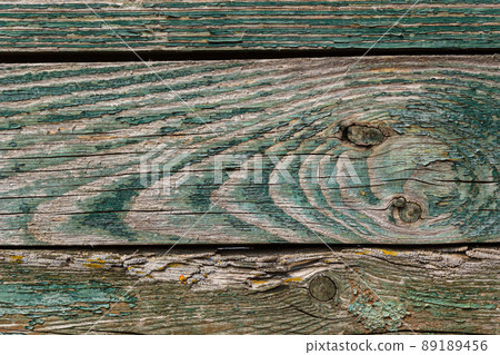Wooden background, old wooden wall, painted blue, with slits and nails Wooden background, old wooden wall, painted blue, with slits and nails 89189456