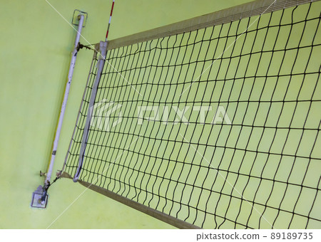 volleyball net on a yellow background. in the gym 89189735