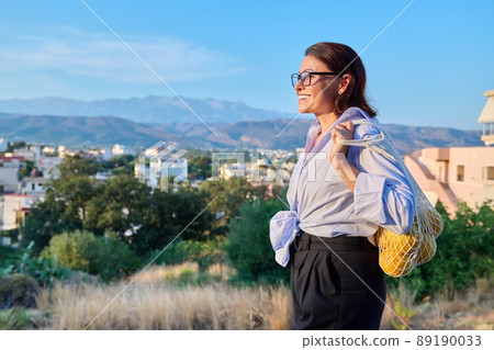 Happy calm woman enjoying vacation in nature, profile view Happy calm woman enjoying vacation in nature, profile view 89190033