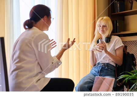 Teenage female in therapy session in psychologist's office 89190035