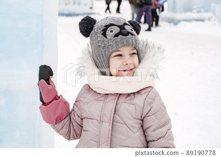 cute little caucasian girl with ice sculptures cute little caucasian girl with ice sculptures 89190778