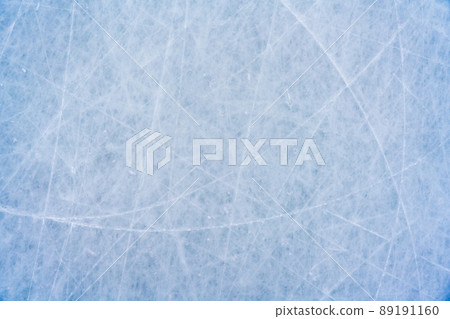 Ice background with marks from skating and hockey, blue texture of rink surface with scratches Ice background with marks from skating and hockey, blue texture of rink surface with scratches 89191160