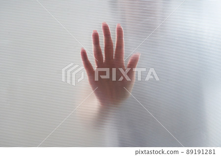 Diffused silhouette of female hands through plastic 89191281