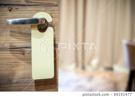 An empty sign on the hotel door handle for your text An empty sign on the hotel door handle for your text 89191477