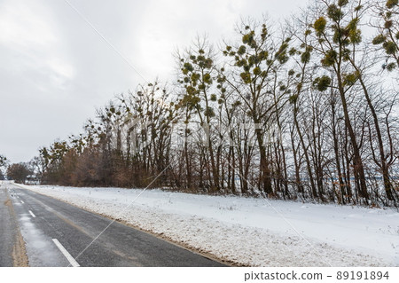 driving in winter after a snowfall, ice on the road, temperatures below zero driving in winter after a snowfall, ice on the road, temperatures below zero 89191894