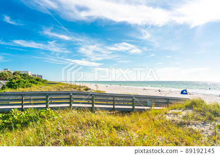 Wooden Boardwalk to Indian rocks beach in Florida, USA 89192145