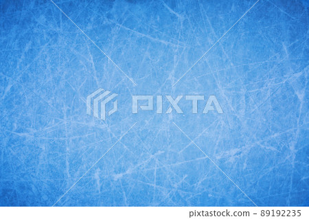 Ice background with marks from skating and hockey, blue texture of rink surface with many scratches Ice background with marks from skating and hockey, blue texture of rink surface with many scratches 89192235