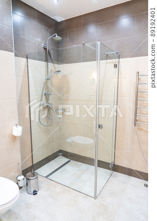 Glass shower walk in cabin in modern interior 89192401