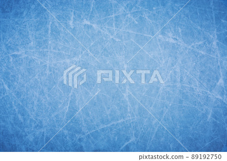 Ice background with marks from skating and hockey, blue texture of rink surface with many scratches 89192750