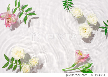 Sunny summer cosmetic background with flowers. The texture of the water surface. Sunny summer cosmetic background with flowers. The texture of the water surface. 89193331