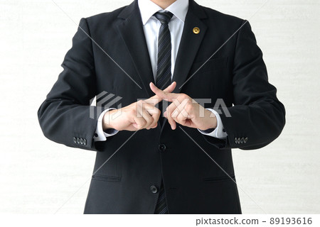 Male lawyer who puts out a cross Male lawyer who puts out a cross 89193616
