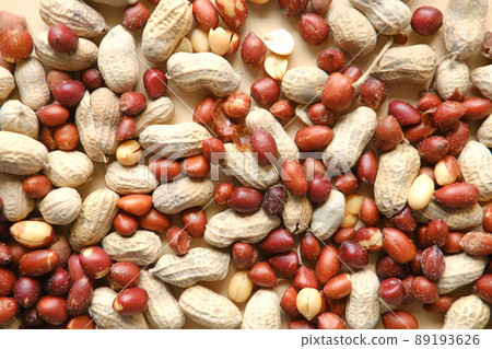 Processed pea nuts in a bowl on table top down . Processed pea nuts in a bowl on table top down . 89193626