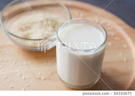glass of milk and rice on a table, non dairy milk concept  89193675