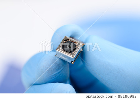 Smartphone single camera module in scientist hands 89196982
