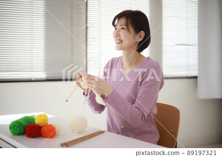 Female knitting Female knitting 89197321