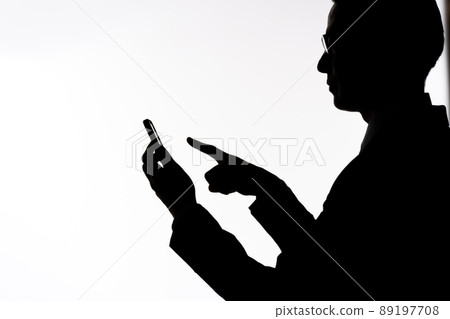 Businessman smartphone silhouette 89197708