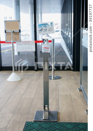 Alcohol disinfectant spray installed inside the building 89197737