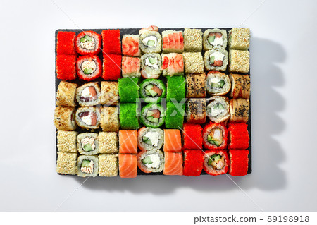 Japanese food restaurant, sushi maki gunkan roll plate or platter set. California Sushi rolls with salmon. Sushi isolated at white background. Top view, flat lay. 89198918