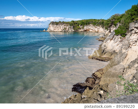 Macao beach with turquoise water and stone cliff 89199220