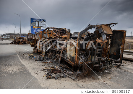 Hostomel, Kyev region Ukraine - 09.04.2022: Cities of Ukraine after the Russian occupation. Military vehicles that burned down after being hit by a shell. Hostomel, Kyev region Ukraine - 09.04.2022: Cities of Ukraine after the Russian occupation. Military vehicles that burned down after being hit by a shell. 89200117