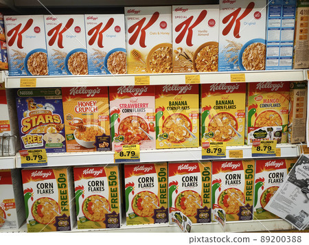 SELANGOR, MALAYSIA - MARCH 5, 2022: SELANGOR, MALAYSIA - MARCH 5, 2022: Kellogg's corn flakes in commercial packaging are made from paper boxes. On display for sale in-store.  89200388