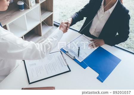 Attractive young business woman in a job interview with a corporate personnel manager 89201037