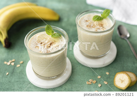 banana milkshake with oatmeal in a glass 89201121