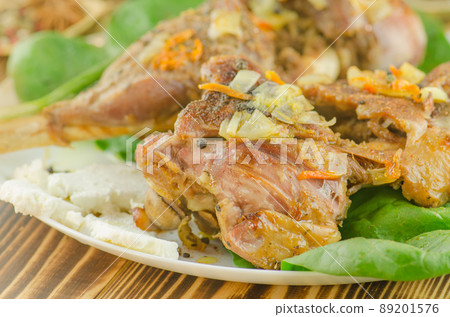 Baked meat with vegetables and greens Baked meat with vegetables and greens 89201576
