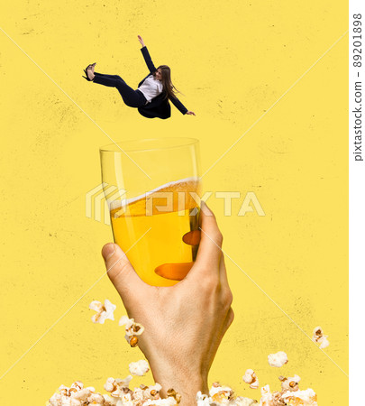 Contemporary art collage. Cheerful woman falling down into glass with foamy lager beer isolated over yellow background 89201898