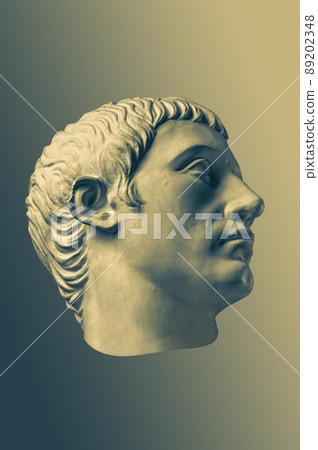 Bronze color gypsum copy of ancient statue of Germanicus Julius Caesar head for artists on brass background. Renaissance epoch. Plaster sculpture of man face. Template for art design Bronze color gypsum copy of ancient statue of Germanicus Julius Caesar head for artists on brass background. Renaissance epoch. Plaster sculpture of man face. Template for art design 89202348