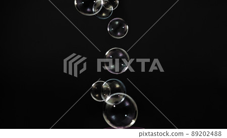 Soap bubble drop or Shampoo bubbles floating like flying in the air black background which represent refreshing moments and gentle soft. Bubbles drops for soap  shampoo or detergent product industry. 89202488