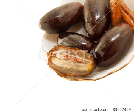 Fresh big dates  isolated on white background. close up 89202499