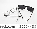 sunglasses and magnifying glass 89204433