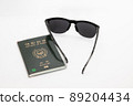 sunglasses and passport 89204434