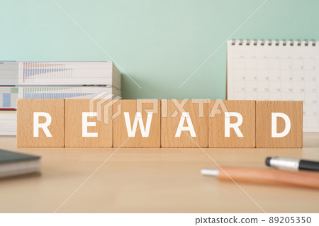 Image of reward | Desk with building blocks with "REWARD" written on it Image of reward | Desk with building blocks with "REWARD" written on it 89205350