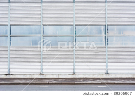 Part of the noise protection fence by the road. 89206907