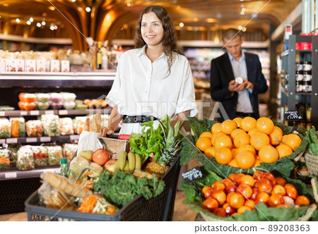 Portrait of a positive girl in the supermarket 89208363