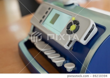 Close-up of a braille typewriter on a desktop. Close-up of a braille typewriter on a desktop. 89210394