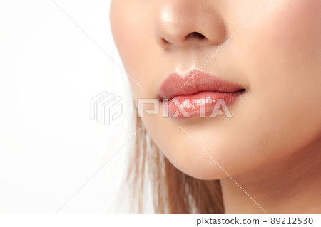 Close up photo with beautiful female face, Sexy plump full lips. Close-up face detail. Perfect natural lip makeup. 89212530