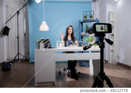 Stylist influencer recording creative beauty tutorial advertising cosmetics product using professional videoblog equipment. Content creator filming vlog for social media platform. Behnind the scene Stylist influencer recording creative beauty tutorial advertising cosmetics product using professional videoblog equipment. Content creator filming vlog for social media platform. Behnind the scene 89212776