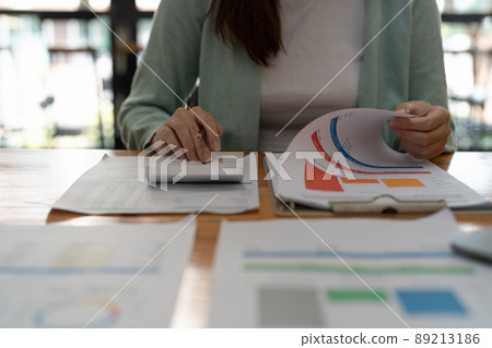 Close up hand of accountant working with calculator for business and financial expense. Close up hand of accountant working with calculator for business and financial expense. 89213186