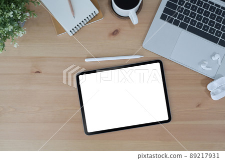 Modern workplace with digital tablet, wireless stylus pen and laptop computer. Top view. 89217931