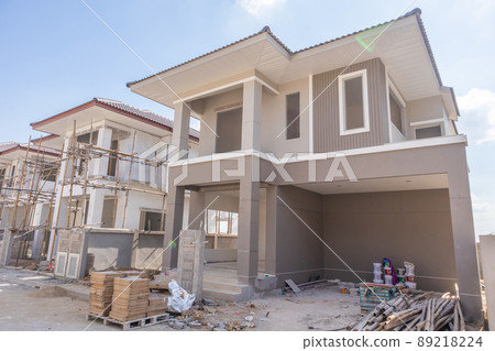 construction residential new house in progress at building site housing estate development 89218224