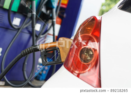 To fill the machine with fuel. Car fill with gasoline at a gas station. Gas station pump 89218265