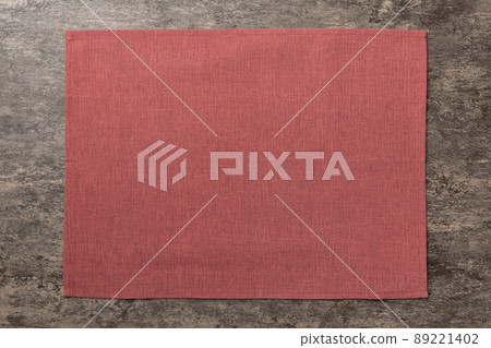 Top view of red tablecloth for food on cement background. Empty space for your design 89221402