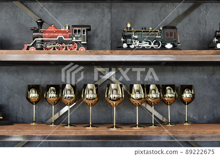 Train model and gold cup decorate on shelf Train model and gold cup decorate on shelf 89222675
