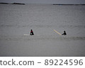 Cloudy wave waiting surfer 89224596