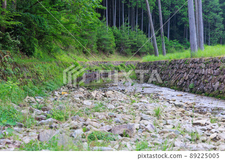River surrounded by mountains in the countryside 89225005
