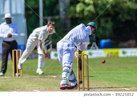 Cricket Batsman Plays Ball Bowler Action Close-Up. 89225852
