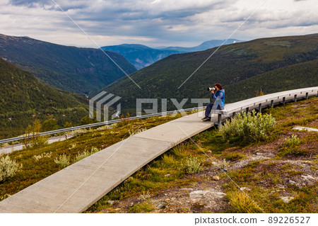 Woman on Vedahaugane rest stop, Norway Woman on Vedahaugane rest stop, Norway 89226527